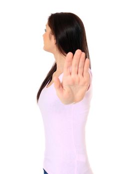 Attractive teenage girl making repelling gesture. All on white background.