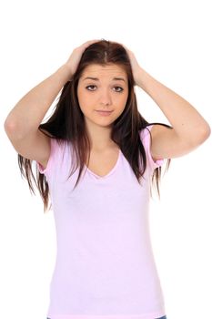 Attractive teenage girl in desperate mood. All on white background.