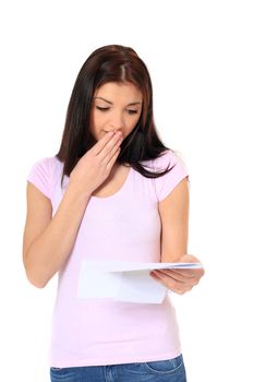 Attractive teenage girl getting bad news. All on white background.