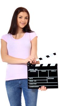Attractive young woman holding clapperboard. All on white background