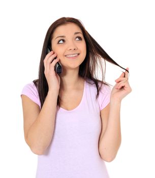 Attractive teenage girl talking on the phone. All on white background.
