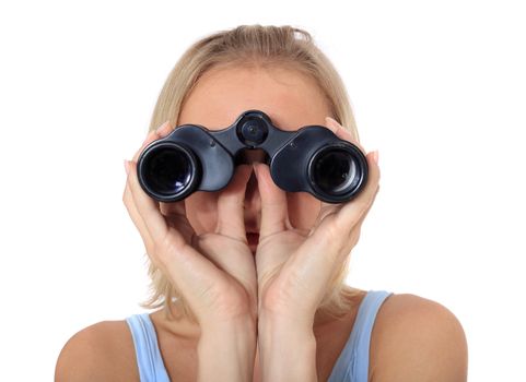 Attractive young scandinavian woman using spyglass. All on white background.