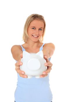Attractive young scandinavian woman holding piggy bank. All on white background