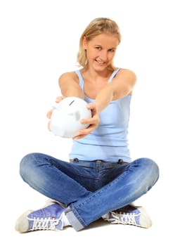 Attractive young scandinavian woman holding piggy bank. All on white background.