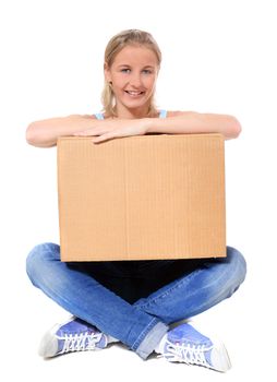 Attractive young scandinavian woman holding moving box. All on white background.