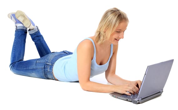 Attractive young scandinavian woman using notebook computer. All on white background.