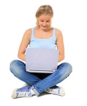 Attractive young scandinavian woman sitting on the floor using notebook computer. All on white background.