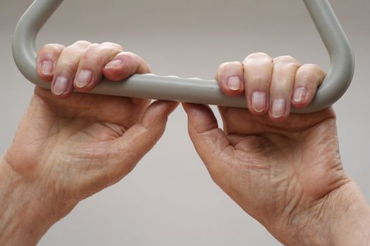 Old wrinkled hands of an elderly person.