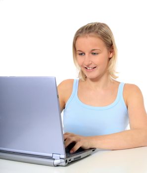 Attractive young scandinavian woman using notebook computer. All on white background.