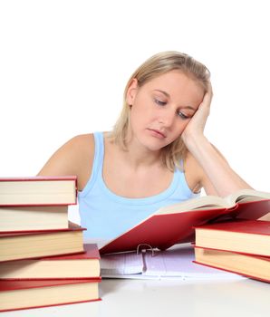 Attractive young scandinavian woman is taking a nap on her study documents. All on white background.