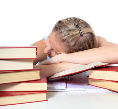 Attractive young scandinavian woman is taking a nap on her study documents. All on white background.