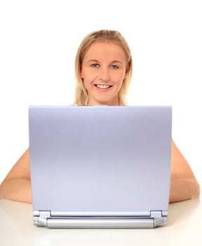 Attractive young scandinavian woman using notebook computer. All on white background.