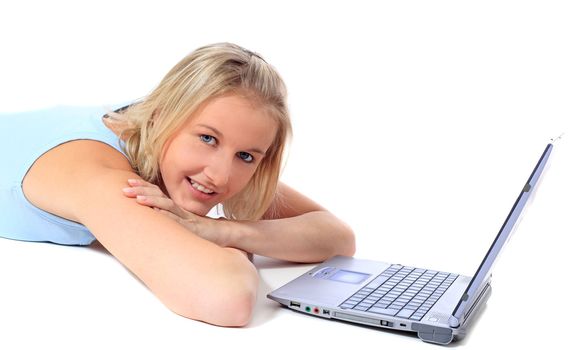 Attractive young scandinavian woman using notebook computer. All on white background.