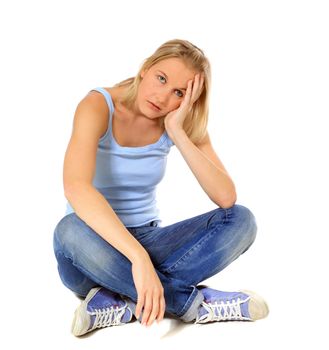 Frustrated scandinavian girl sitting on floor. All on white background.