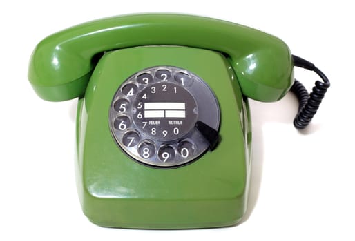 Green vintage telephone. All isolated on white background.