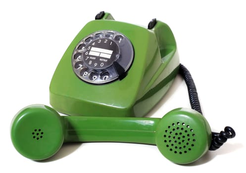 Green vintage telephone. All isolated on white background.