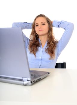 Portrait of an attractive young girl in front of her notebook computer. All on white background.