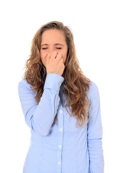 Attractive young girl holding her nose. All on white background.