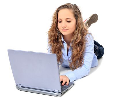 Attractive young girl using notebook computer. All on white background.