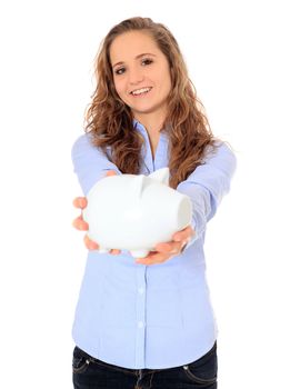 Attractive young girl holding piggy bank. All on white background.