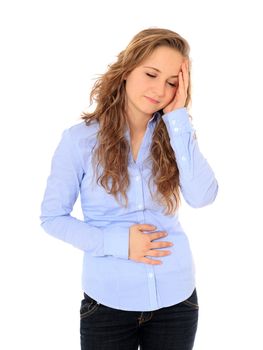 Attractive young girl suffering from pain in the abdomen and headache. All on white background.