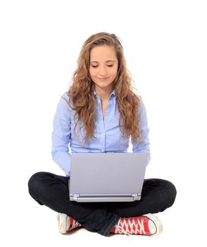 Attractive young girl using notebook computer. All on white background.