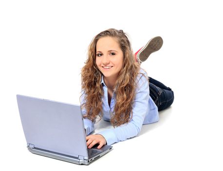 Attractive young girl using notebook computer. All on white background.