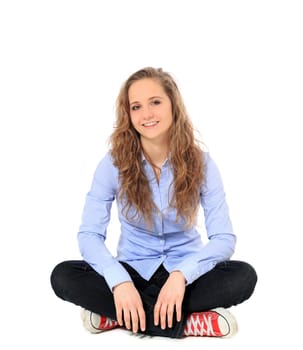 Attractive young girl sitting on the floor. All on white background.