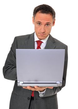 Attractive businessman using notebook computer. All on white background.
