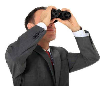 Attractive businessman using spyglass. All on white background.