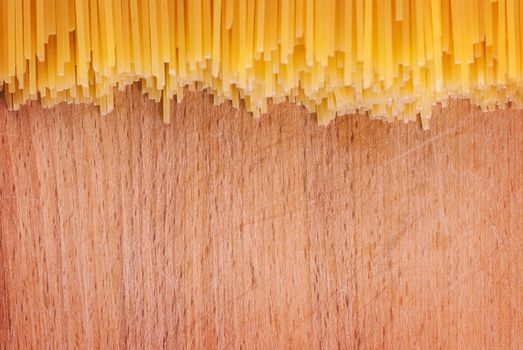 pasta on a wooden board, background