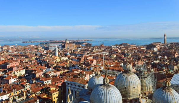 St. Mark's Cathedral in Venice (Italy) from above with city roofs in distance