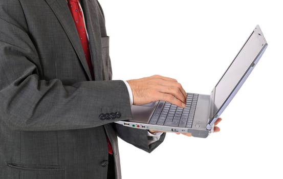 Businessman using notebook computer. All on white background.