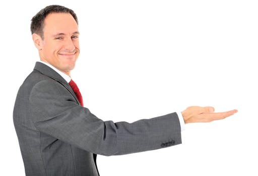 Attractive businessman pointing to the side. All on white background.