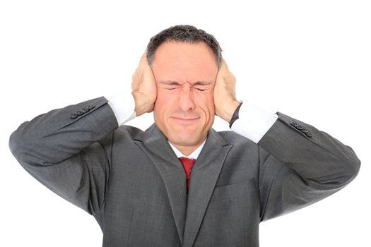 Attractive businessman shuts his ears. All on white background.