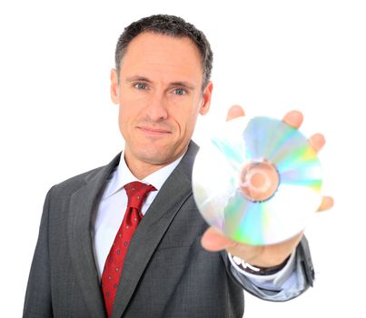 Attractive businessman holding dvd. All on white background.