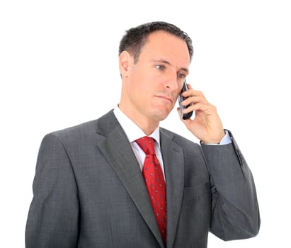 Serious businessman making a phone call. All on white background.