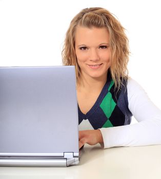 Attractive blonde woman using notebook computer. All on white background.