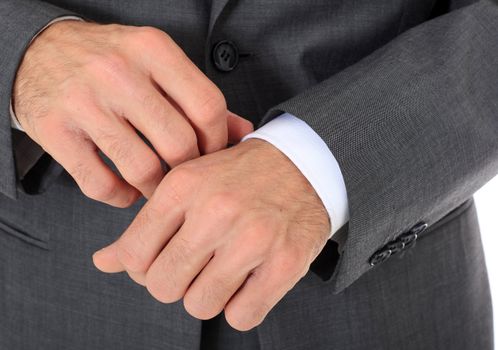 Businessman checking his clothes. All on white background.