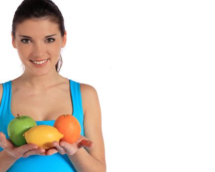 Attractive young woman holding various fruits. Extra text space on right side. All on white background.