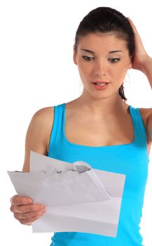 Attractive young woman gets bad news via mail. All on white background.