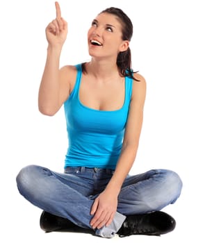 Attractive young woman pointing with finger. All on white background.