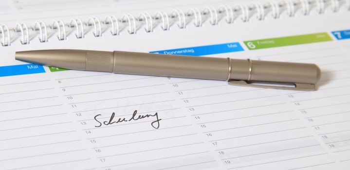 A standard schedule. The german term Schulung is marked. (english: schooling)