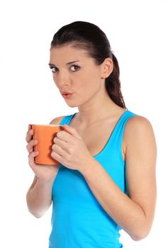 Attractive young woman holding a mug. All on white background.