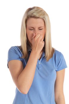 An attractive young woman sneezing. All on white background.