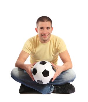 Attractive young man holding a soccer ball. All on white background.