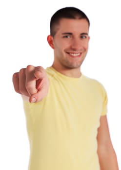 Attractive young man pointing with finger. All on white background.