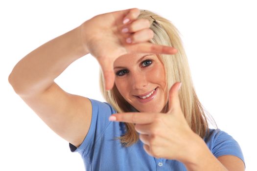 Attractive young woman building a frame out of her hands. All on white background.