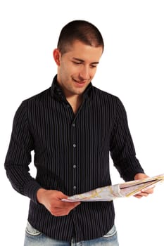 Attractive young man looking at a map. All isolated on white background.