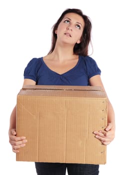 Exhausted young woman carrying a moving box.